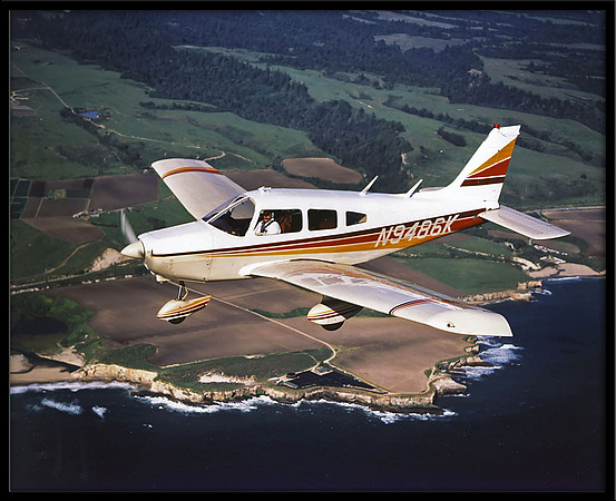 Air-to-air photo of a Piper Warrior